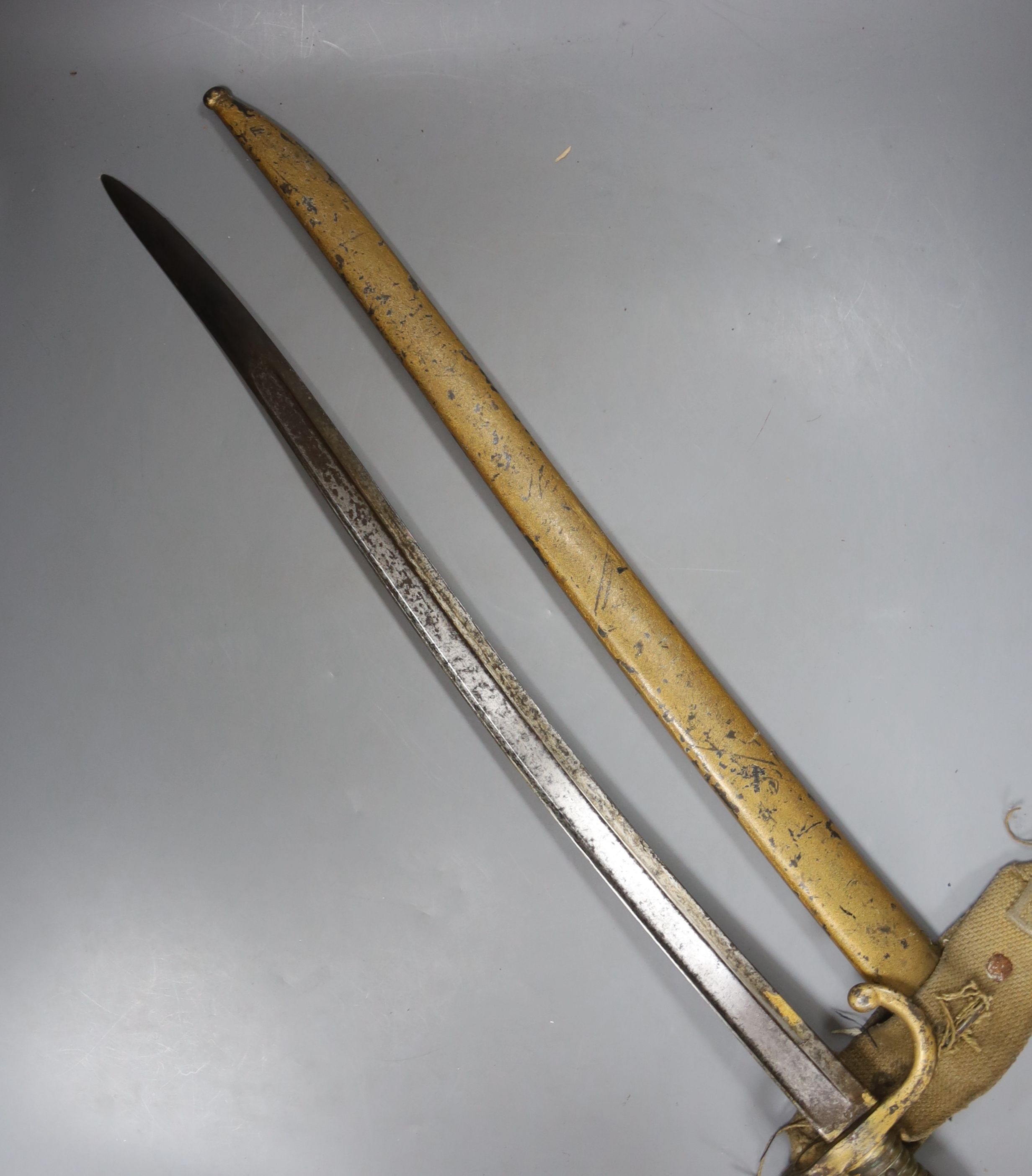 A bayonet with scabbard and a knife, bayonet 71 cms long.
